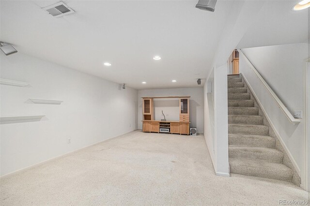 5502 E Center Ave, Denver, CO 80246 - finished basement with recessed lighting, light carpet, and stairs