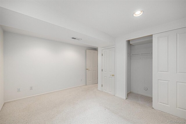 5502 E Center Ave, Denver, CO 80246 - unfurnished bedroom with recessed lighting, light colored carpet, and a closet