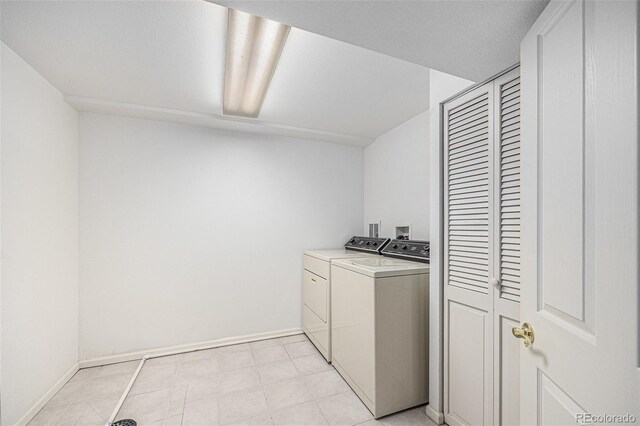 5502 E Center Ave, Denver, CO 80246 - laundry area with separate washer and dryer and baseboards