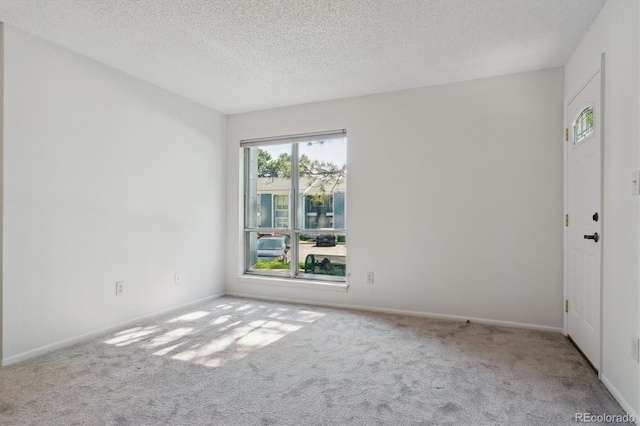7275 S Gaylord St Unit I09, Littleton, CO 80122 - spare room with carpet flooring, a textured ceiling, and baseboards