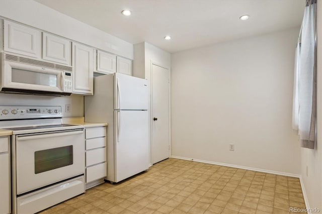 7275 S Gaylord St Unit I09, Littleton, CO 80122 - kitchen featuring white appliances, light countertops, white cabinets, light flooring, and recessed lighting