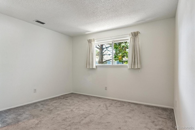 7275 S Gaylord St Unit I09, Littleton, CO 80122 - spare room featuring carpet floors, a textured ceiling, and baseboards