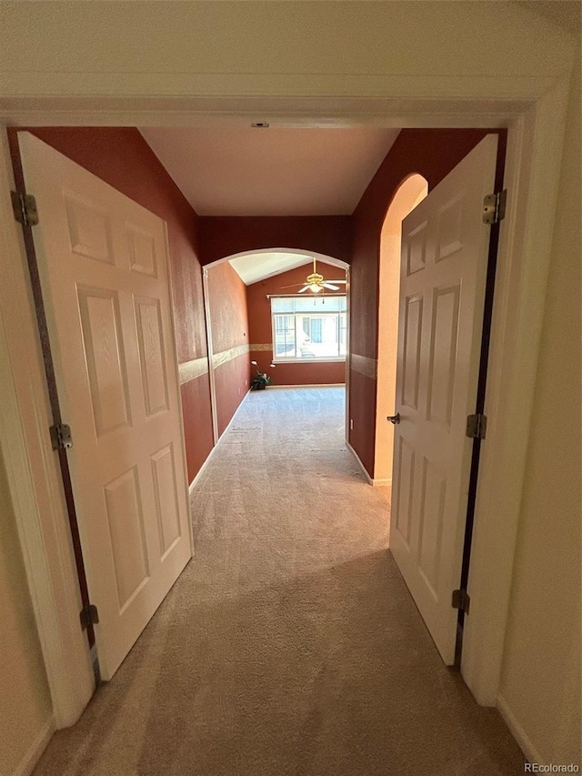 11207 Osage Cir Unit B, Northglenn, CO 80234 - hallway with carpet flooring, arched walkways, and baseboards