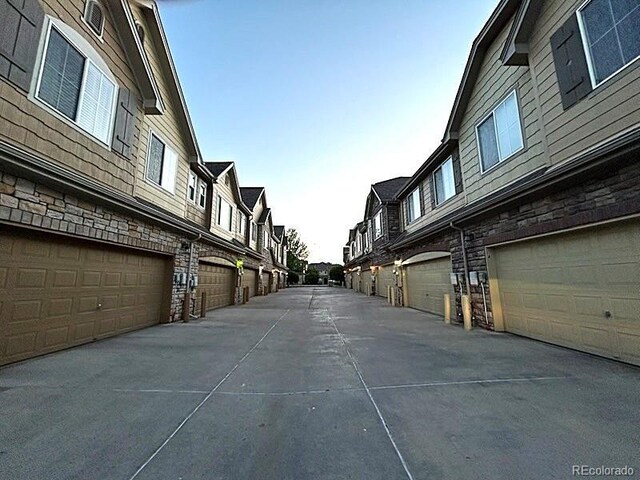 11207 Osage Cir Unit B, Northglenn, CO 80234 - view of concrete alley featuring a residential view