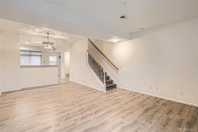 unfurnished living room with light wood-type flooring