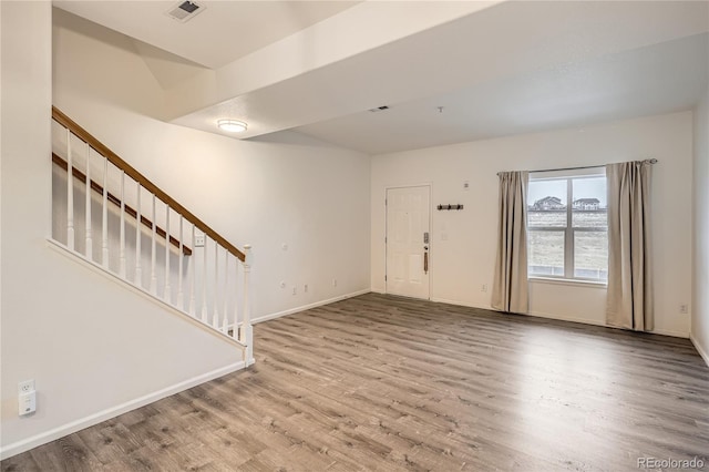 foyer entrance with hardwood / wood-style flooring