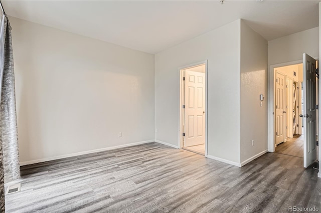 unfurnished bedroom featuring hardwood / wood-style floors