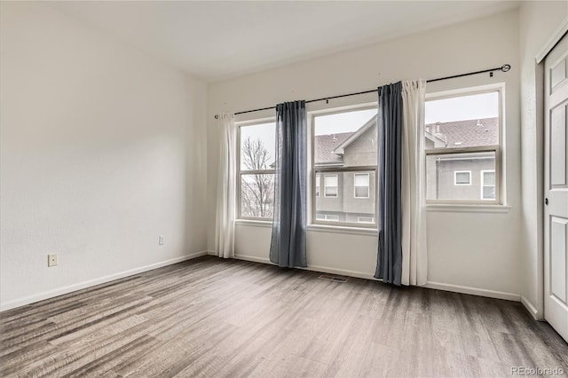 empty room featuring light hardwood / wood-style floors