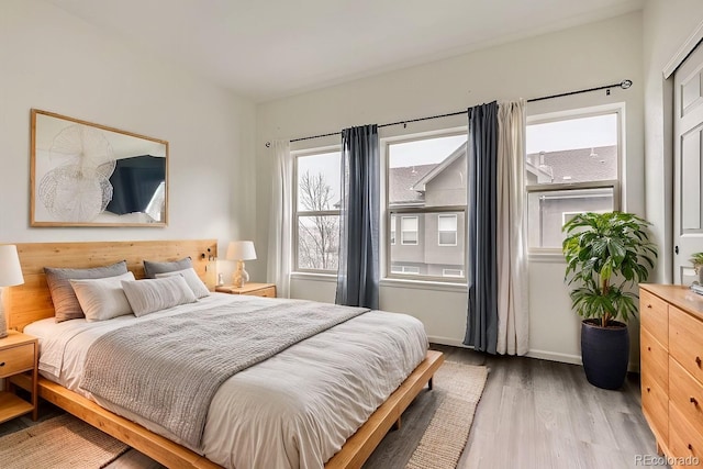 bedroom with hardwood / wood-style flooring