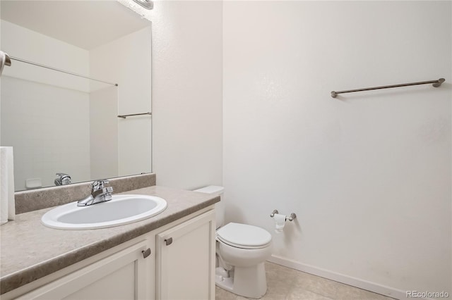 bathroom featuring vanity, tile patterned floors, and toilet