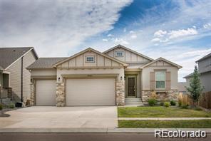 7031 Thorn Brush Way, Colorado Springs, CO 80923 - craftsman house featuring a garage, concrete driveway, and stone siding