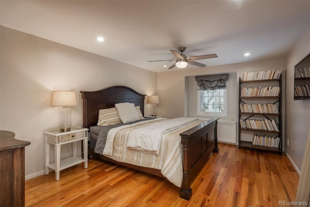 bedroom with hardwood / wood-style floors and ceiling fan