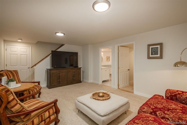 living room featuring light carpet and baseboards