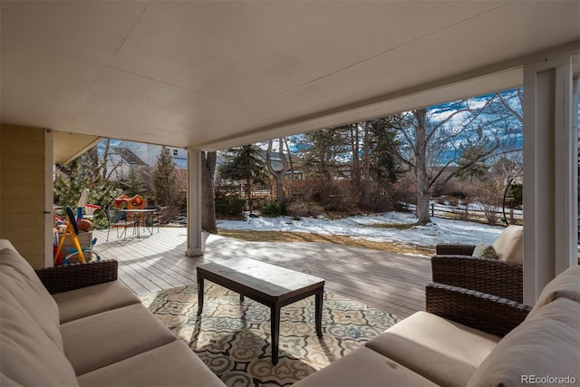 snow covered deck with an outdoor hangout area