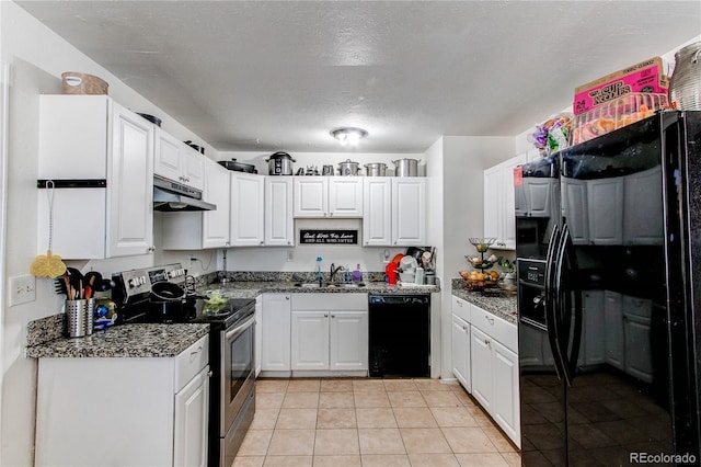 kitchen featuring a sink, light tile patterned floors, black appliances, under cabinet range hood, and white cabinetry