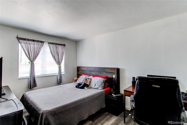 bedroom featuring wood finished floors