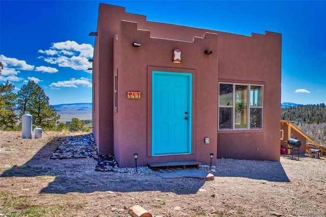 147 Sulky Ct, Hartsel, CO 80449 - view of exterior entry with stucco siding and a mountain view
