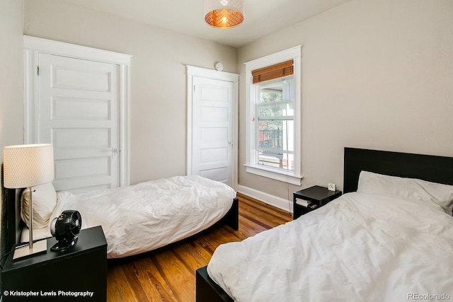 284 S Lafayette St, Denver, CO 80209 - bedroom with wood finished floors and baseboards