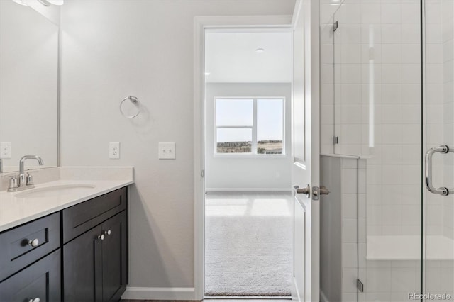 bathroom with vanity and a shower stall
