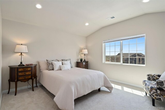 bedroom with light carpet and vaulted ceiling