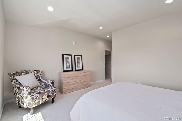 carpeted bedroom featuring vaulted ceiling