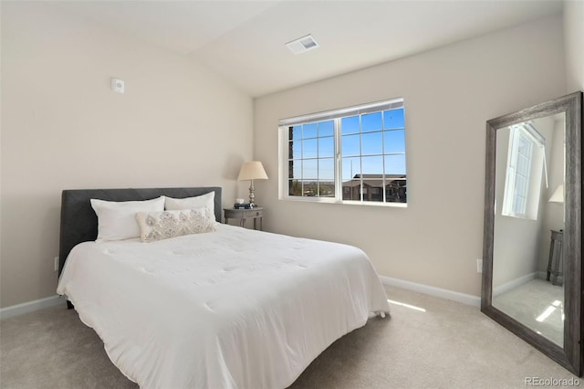 bedroom featuring carpet and lofted ceiling