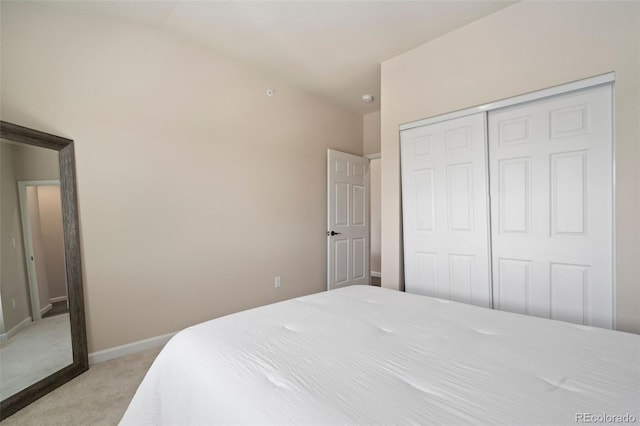 carpeted bedroom with a closet