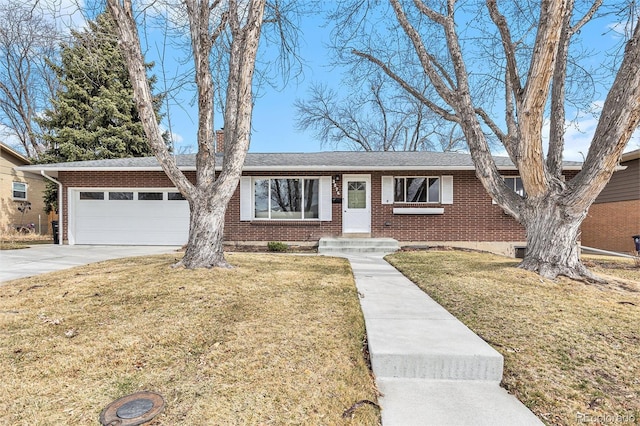 ranch-style house featuring a garage, concrete driveway, a front lawn, and brick siding