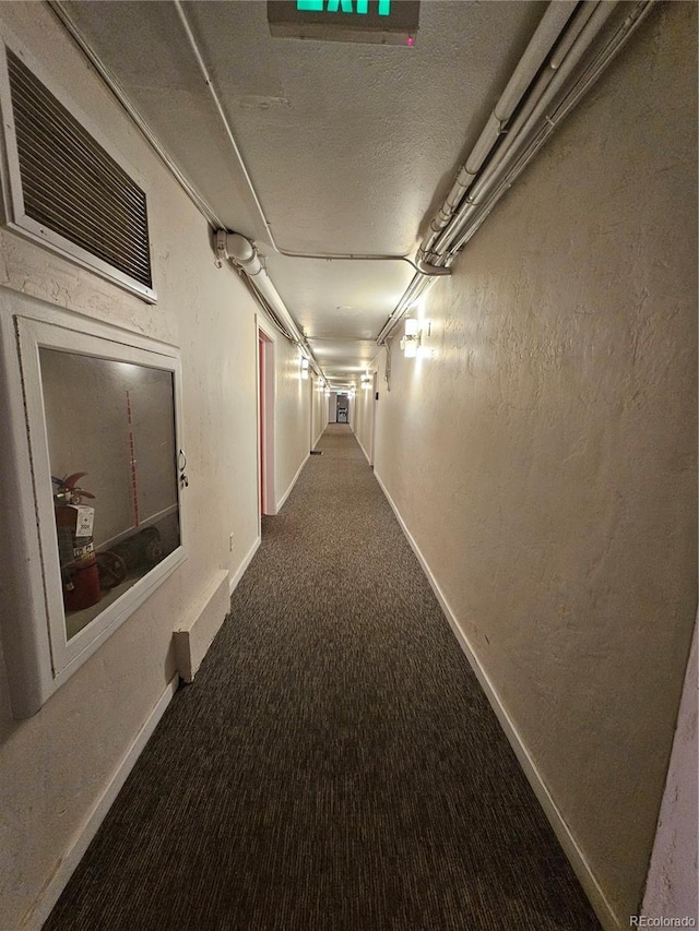 1270 N Marion St Unit 103, Denver, CO 80218 - hallway featuring baseboards and carpet floors