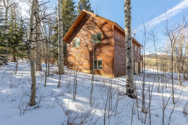 view of snow covered property