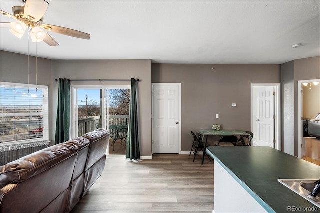 2428 W 82nd Pl Unit 2D, Westminster, CO 80031 - living area with light wood finished floors and ceiling fan
