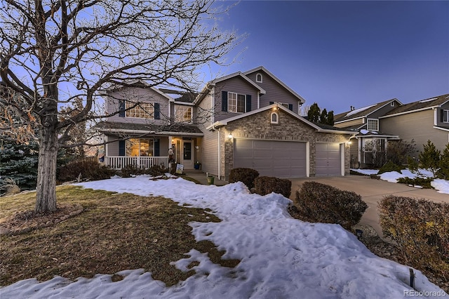 front of property with a porch and a garage