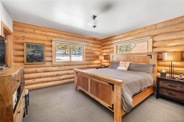 carpeted bedroom with log walls