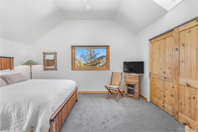 bedroom featuring vaulted ceiling and light carpet