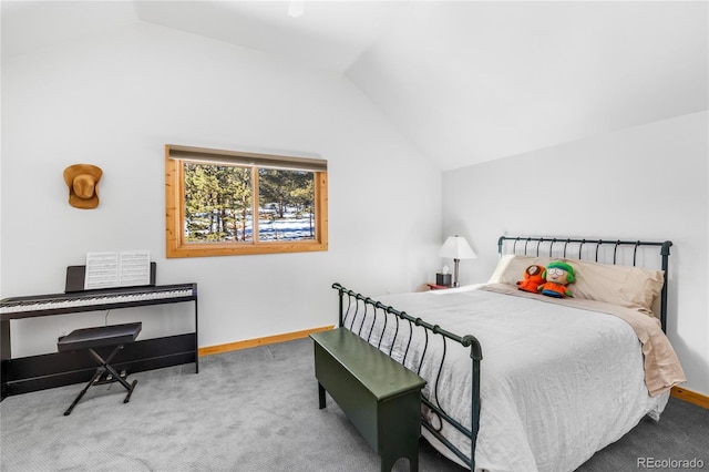 carpeted bedroom with lofted ceiling