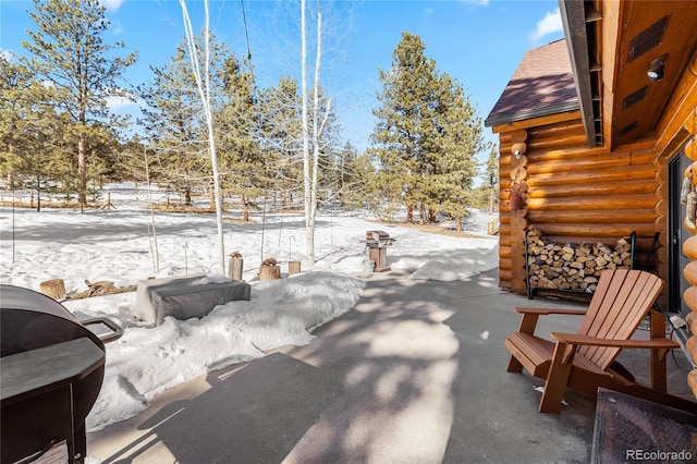 view of snow covered patio