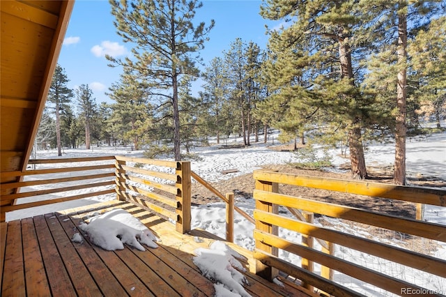 view of snow covered deck