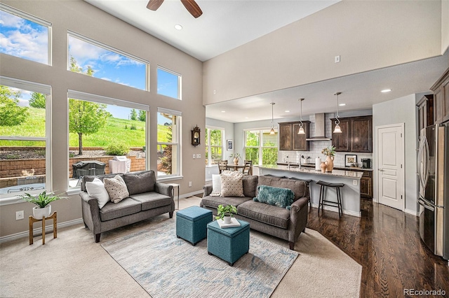 13942 W 87th Dr, Arvada, CO 80005 - living room featuring recessed lighting, a ceiling fan, a towering ceiling, and baseboards