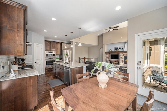 13942 W 87th Dr, Arvada, CO 80005 - dining space with ceiling fan, recessed lighting, and dark wood-type flooring