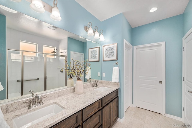 13942 W 87th Dr, Arvada, CO 80005 - full bath with a stall shower, double vanity, and baseboards