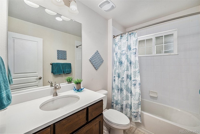 13942 W 87th Dr, Arvada, CO 80005 - bathroom featuring vanity, toilet, and shower / bath combo with shower curtain