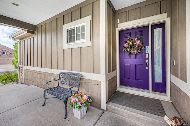 13942 W 87th Dr, Arvada, CO 80005 - view of exterior entry with board and batten siding