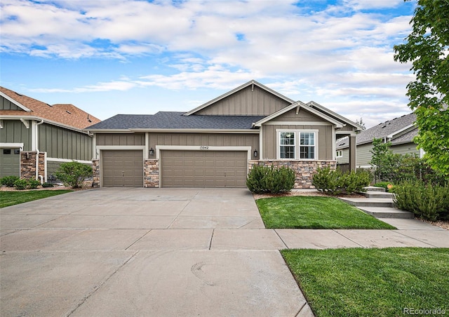 13942 W 87th Dr, Arvada, CO 80005 - craftsman-style home featuring stone siding, a garage, board and batten siding, concrete driveway, and a front lawn