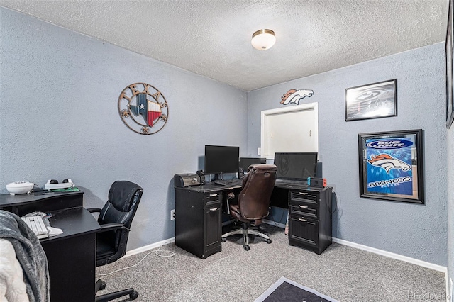 office with a textured ceiling and light carpet