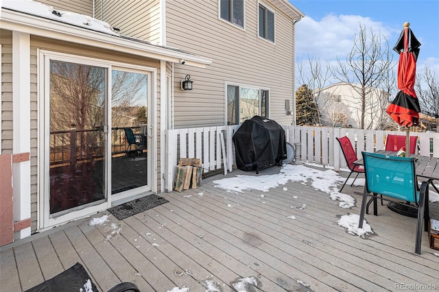 wooden deck with a grill