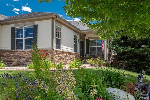 2105 Baguette Dr, Castle Rock, CO 80108 - view of side of home with stone siding