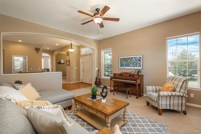 2105 Baguette Dr, Castle Rock, CO 80108 - living room featuring arched walkways, healthy amount of natural light, ceiling fan, and recessed lighting