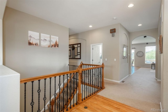 2105 Baguette Dr, Castle Rock, CO 80108 - hallway with arched walkways, recessed lighting, carpet floors, and an upstairs landing