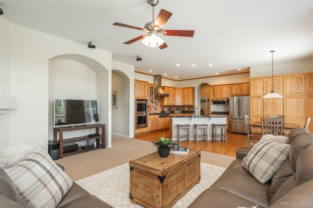 2105 Baguette Dr, Castle Rock, CO 80108 - living room featuring arched walkways, ceiling fan, and recessed lighting