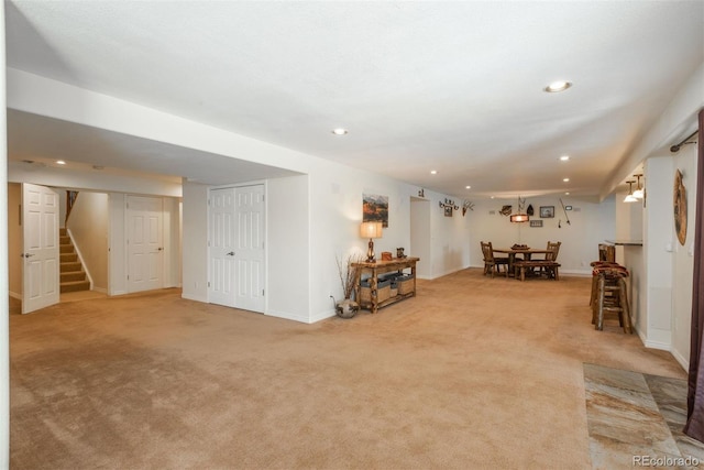 2105 Baguette Dr, Castle Rock, CO 80108 - living room featuring light colored carpet, stairs, and recessed lighting